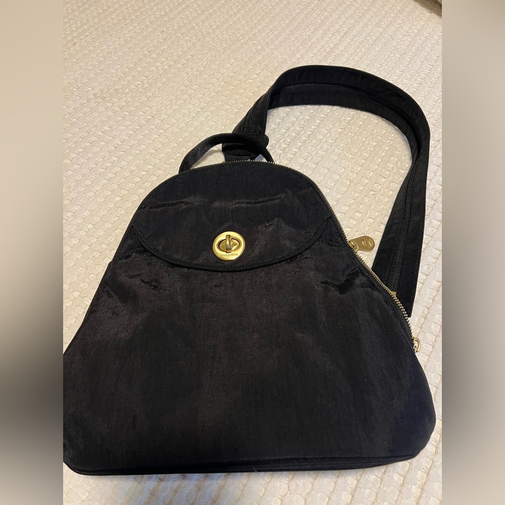 Chic Black Baggallini Backpack with Gold Accents